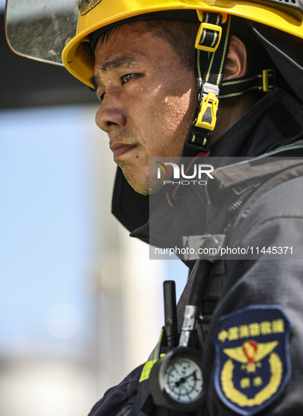 Firefighters are performing a rescue drill at a chemical plant amid high temperatures in Huai'an, China, on July 31, 2024. 