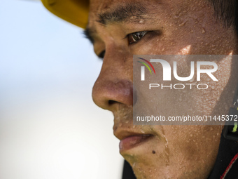 Firefighters are performing a rescue drill at a chemical plant amid high temperatures in Huai'an, China, on July 31, 2024. (