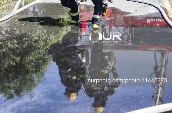 Firefighters are performing a rescue drill at a chemical plant amid high temperatures in Huai'an, China, on July 31, 2024. 