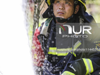 Firefighters are performing a rescue drill at a chemical plant amid high temperatures in Huai'an, China, on July 31, 2024. (