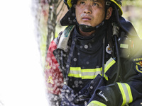 Firefighters are performing a rescue drill at a chemical plant amid high temperatures in Huai'an, China, on July 31, 2024. (