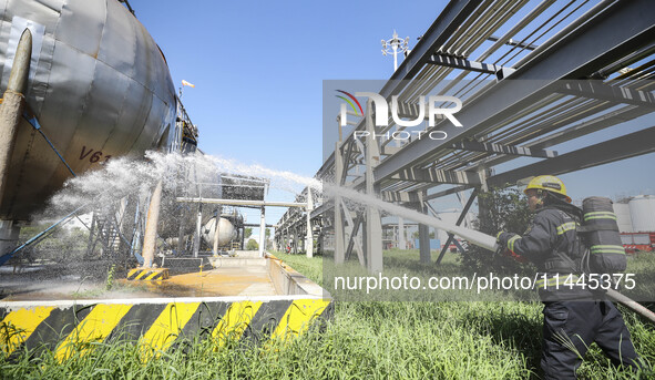 Firefighters are performing a rescue drill at a chemical plant amid high temperatures in Huai'an, China, on July 31, 2024. 