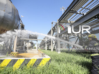 Firefighters are performing a rescue drill at a chemical plant amid high temperatures in Huai'an, China, on July 31, 2024. (