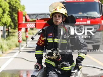 Firefighters are performing a rescue drill at a chemical plant amid high temperatures in Huai'an, China, on July 31, 2024. (