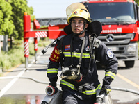 Firefighters are performing a rescue drill at a chemical plant amid high temperatures in Huai'an, China, on July 31, 2024. (