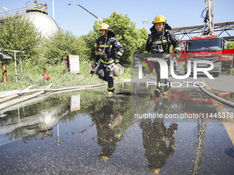 Firefighters are performing a rescue drill at a chemical plant amid high temperatures in Huai'an, China, on July 31, 2024. (