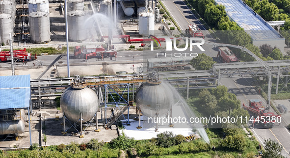 Firefighters are performing a rescue drill at a chemical plant amid high temperatures in Huai'an, China, on July 31, 2024. 