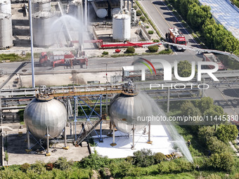 Firefighters are performing a rescue drill at a chemical plant amid high temperatures in Huai'an, China, on July 31, 2024. (