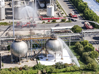 Firefighters are performing a rescue drill at a chemical plant amid high temperatures in Huai'an, China, on July 31, 2024. (