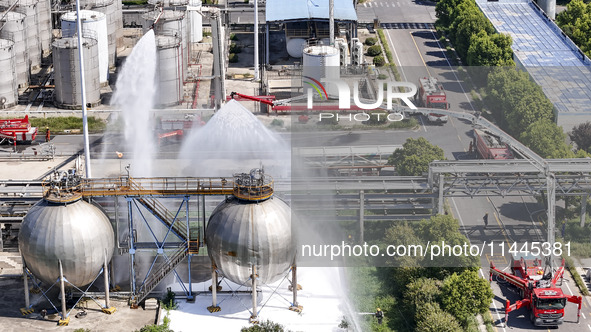 Firefighters are performing a rescue drill at a chemical plant amid high temperatures in Huai'an, China, on July 31, 2024. 