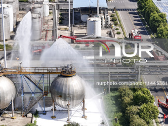 Firefighters are performing a rescue drill at a chemical plant amid high temperatures in Huai'an, China, on July 31, 2024. (