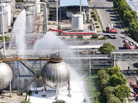 Firefighters are performing a rescue drill at a chemical plant amid high temperatures in Huai'an, China, on July 31, 2024. (