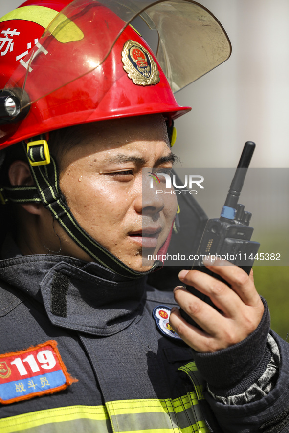 Firefighters are performing a rescue drill at a chemical plant amid high temperatures in Huai'an, China, on July 31, 2024. 