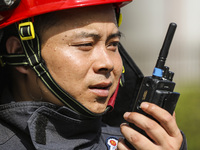 Firefighters are performing a rescue drill at a chemical plant amid high temperatures in Huai'an, China, on July 31, 2024. (