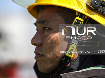 Firefighters are performing a rescue drill at a chemical plant amid high temperatures in Huai'an, China, on July 31, 2024. (