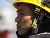 Firefighters are performing a rescue drill at a chemical plant amid high temperatures in Huai'an, China, on July 31, 2024. (