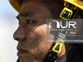 Firefighters are performing a rescue drill at a chemical plant amid high temperatures in Huai'an, China, on July 31, 2024. (