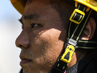 Firefighters are performing a rescue drill at a chemical plant amid high temperatures in Huai'an, China, on July 31, 2024. (