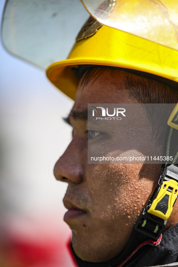 Firefighters are performing a rescue drill at a chemical plant amid high temperatures in Huai'an, China, on July 31, 2024. 