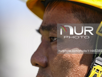 Firefighters are performing a rescue drill at a chemical plant amid high temperatures in Huai'an, China, on July 31, 2024. (