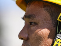 Firefighters are performing a rescue drill at a chemical plant amid high temperatures in Huai'an, China, on July 31, 2024. (