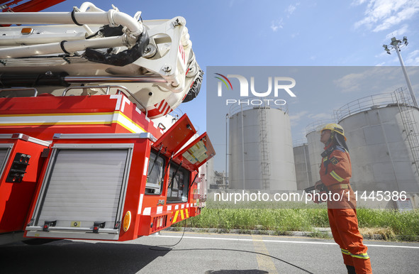 Firefighters are performing a rescue drill at a chemical plant amid high temperatures in Huai'an, China, on July 31, 2024. 