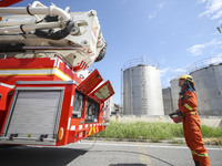 Firefighters are performing a rescue drill at a chemical plant amid high temperatures in Huai'an, China, on July 31, 2024. (