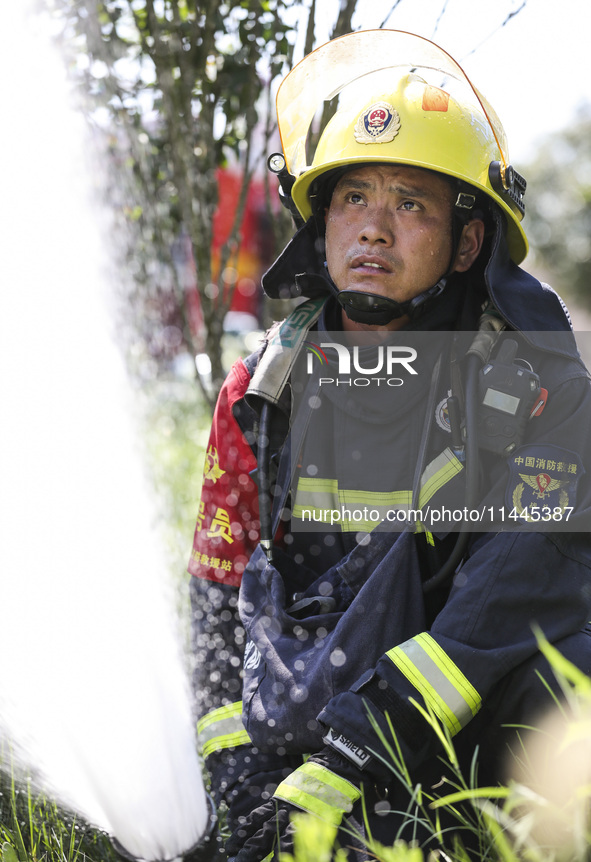 Firefighters are performing a rescue drill at a chemical plant amid high temperatures in Huai'an, China, on July 31, 2024. 