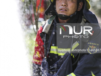 Firefighters are performing a rescue drill at a chemical plant amid high temperatures in Huai'an, China, on July 31, 2024. (