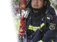 Firefighters are performing a rescue drill at a chemical plant amid high temperatures in Huai'an, China, on July 31, 2024. (