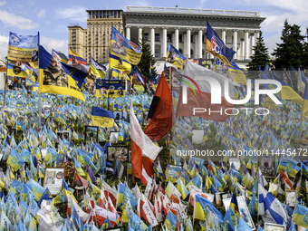 Polish flags are appearing among Ukrainian flags at the makeshift memorial in honor of the Ukrainian Armed Forces soldiers who are dying in...