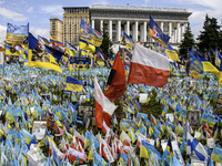 Polish flags are appearing among Ukrainian flags at the makeshift memorial in honor of the Ukrainian Armed Forces soldiers who are dying in...