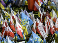 Polish flags are appearing among Ukrainian flags at the makeshift memorial in honor of the Ukrainian Armed Forces soldiers who are dying in...