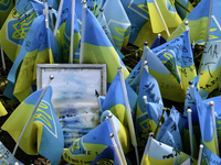 Portraits are fading in the sun at a makeshift memorial in honor of the Ukrainian Armed Forces soldiers who died in battles with Russian tro...