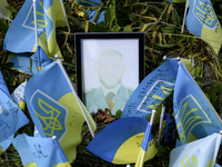 Portraits are fading in the sun at a makeshift memorial in honor of the Ukrainian Armed Forces soldiers who died in battles with Russian tro...