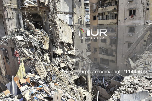 A view is showing a partially destroyed building, which is being targeted by the Israeli army, in Beirut, Lebanon, on July 31, 2024. The Isr...