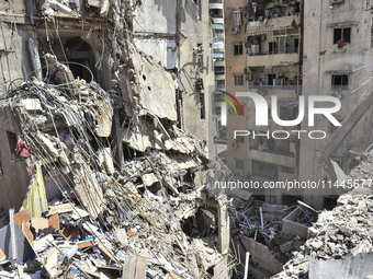 A view is showing a partially destroyed building, which is being targeted by the Israeli army, in Beirut, Lebanon, on July 31, 2024. The Isr...