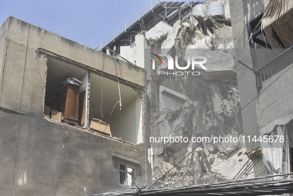 A view is showing a partially destroyed building, which is being targeted by the Israeli army, in Beirut, Lebanon, on July 31, 2024. The Isr...