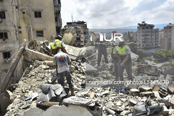 A view is showing a partially destroyed building, which is being targeted by the Israeli army, in Beirut, Lebanon, on July 31, 2024. The Isr...