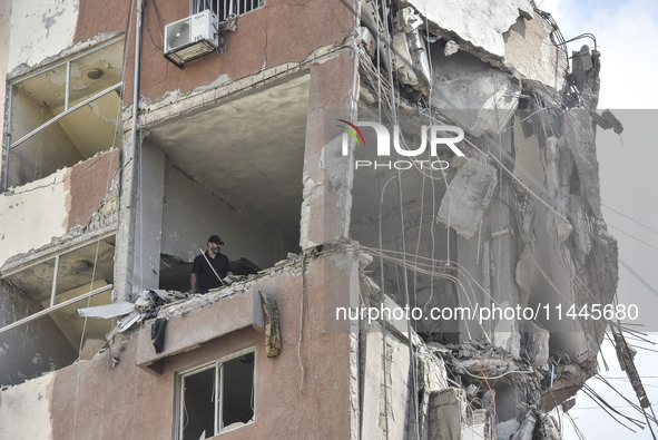 A view is showing a partially destroyed building, which is being targeted by the Israeli army, in Beirut, Lebanon, on July 31, 2024. The Isr...