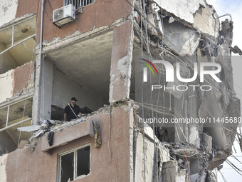 A view is showing a partially destroyed building, which is being targeted by the Israeli army, in Beirut, Lebanon, on July 31, 2024. The Isr...