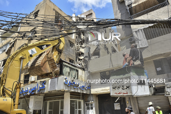 A view is showing a partially destroyed building, which is being targeted by the Israeli army, in Beirut, Lebanon, on July 31, 2024. The Isr...