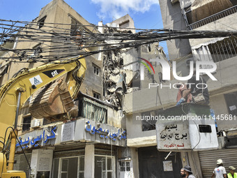 A view is showing a partially destroyed building, which is being targeted by the Israeli army, in Beirut, Lebanon, on July 31, 2024. The Isr...