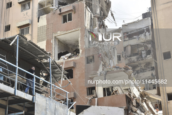 A view is showing a partially destroyed building, which is being targeted by the Israeli army, in Beirut, Lebanon, on July 31, 2024. The Isr...