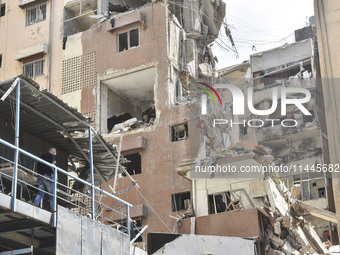 A view is showing a partially destroyed building, which is being targeted by the Israeli army, in Beirut, Lebanon, on July 31, 2024. The Isr...