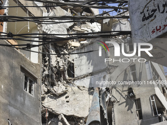 A view is showing a partially destroyed building, which is being targeted by the Israeli army, in Beirut, Lebanon, on July 31, 2024. The Isr...