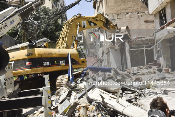 A view is showing a partially destroyed building, which is being targeted by the Israeli army, in Beirut, Lebanon, on July 31, 2024. The Isr...