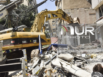 A view is showing a partially destroyed building, which is being targeted by the Israeli army, in Beirut, Lebanon, on July 31, 2024. The Isr...