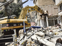 A view is showing a partially destroyed building, which is being targeted by the Israeli army, in Beirut, Lebanon, on July 31, 2024. The Isr...