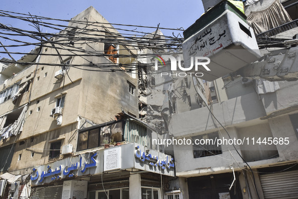 A view is showing a partially destroyed building, which is being targeted by the Israeli army, in Beirut, Lebanon, on July 31, 2024. The Isr...